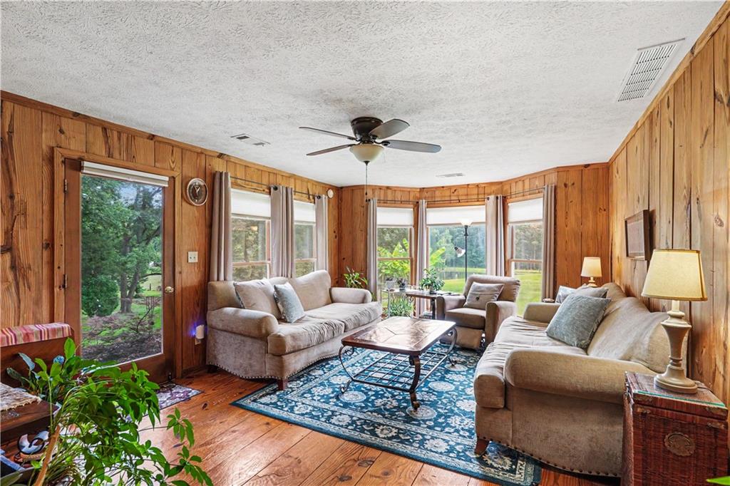 355 Inman Road Hampton, GA 30228 - Photo 13 of 47 a living room with furniture and a large window