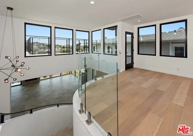 a view of a living room and a floor to ceiling window