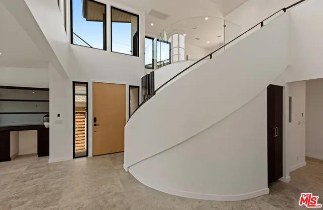 a view of a hallway with staircase