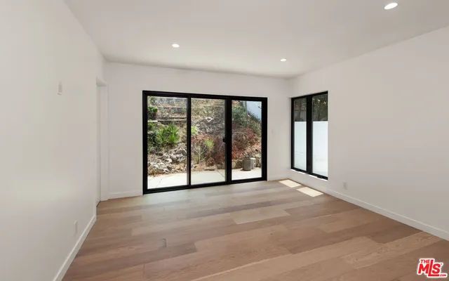 a view of an empty room with a sliding door