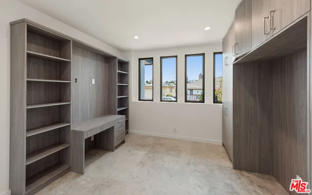 a view of an empty room with a closet