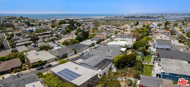 an aerial view of a city with lots of residential buildings