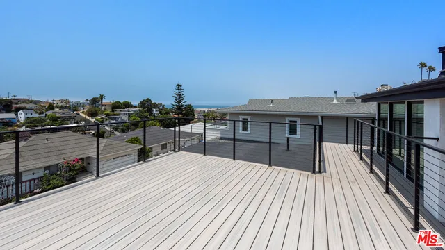 a view of a balcony with chairs