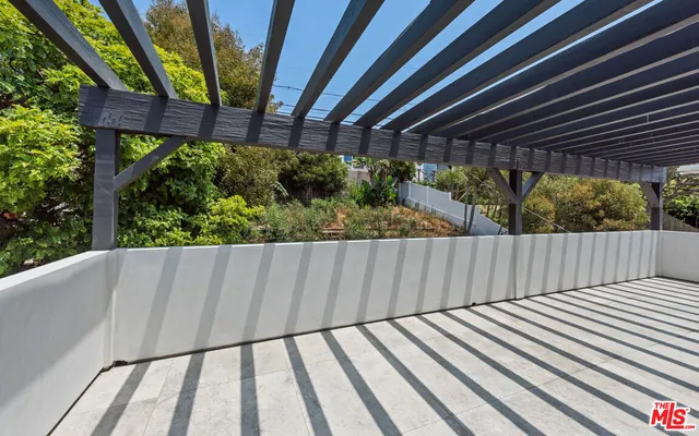a view of outdoor space with wooden floor