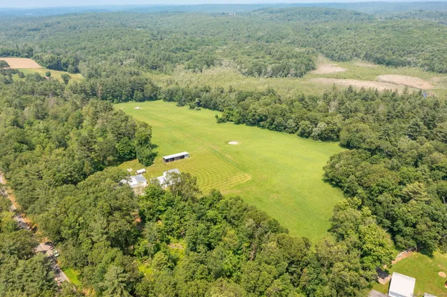 a view of a lake with a yard