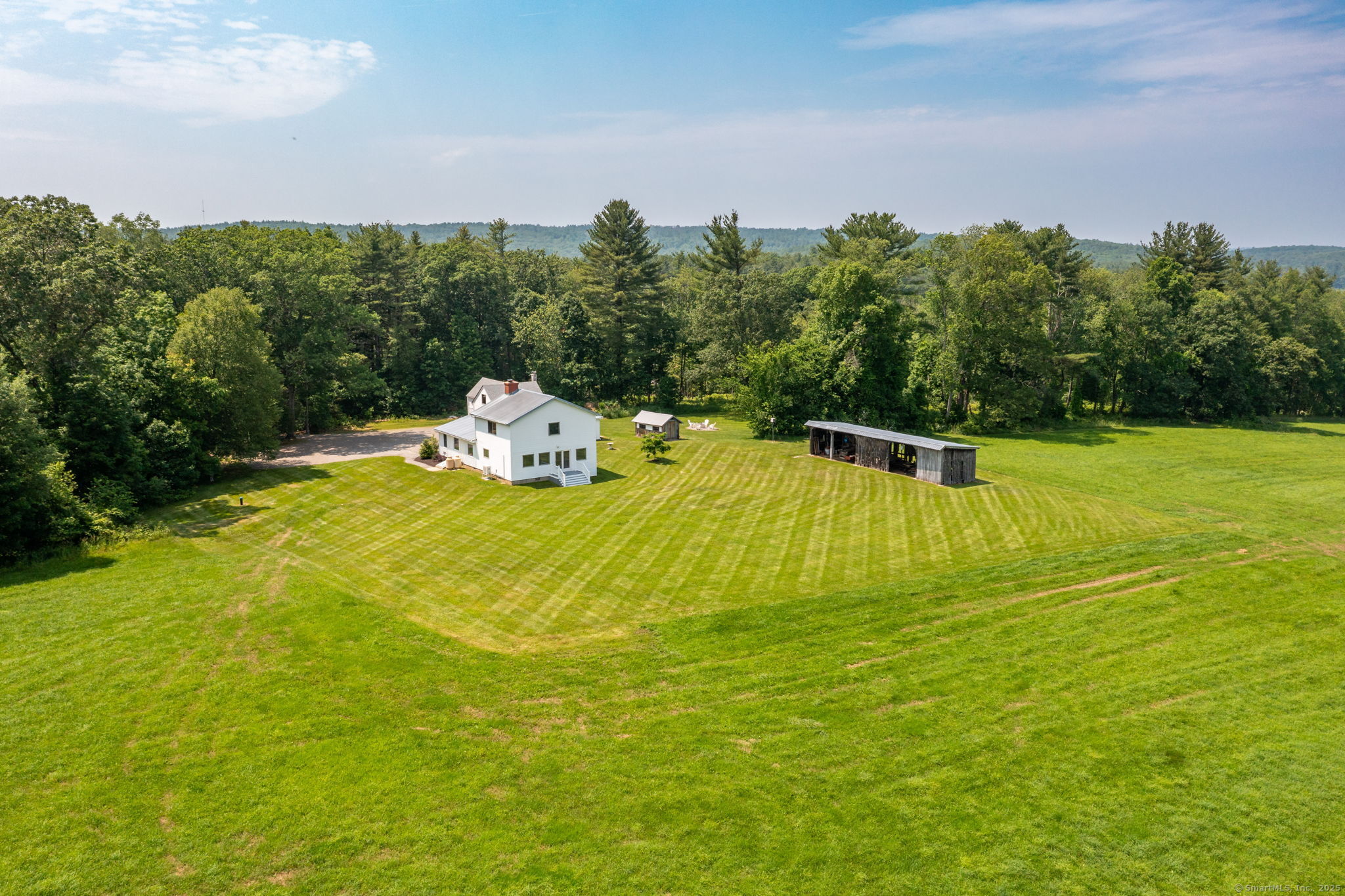 1669 Highway 169 Woodstock, CT 06281 - Photo 13 of 39 a view of a swimming pool with an outdoor seating and yard