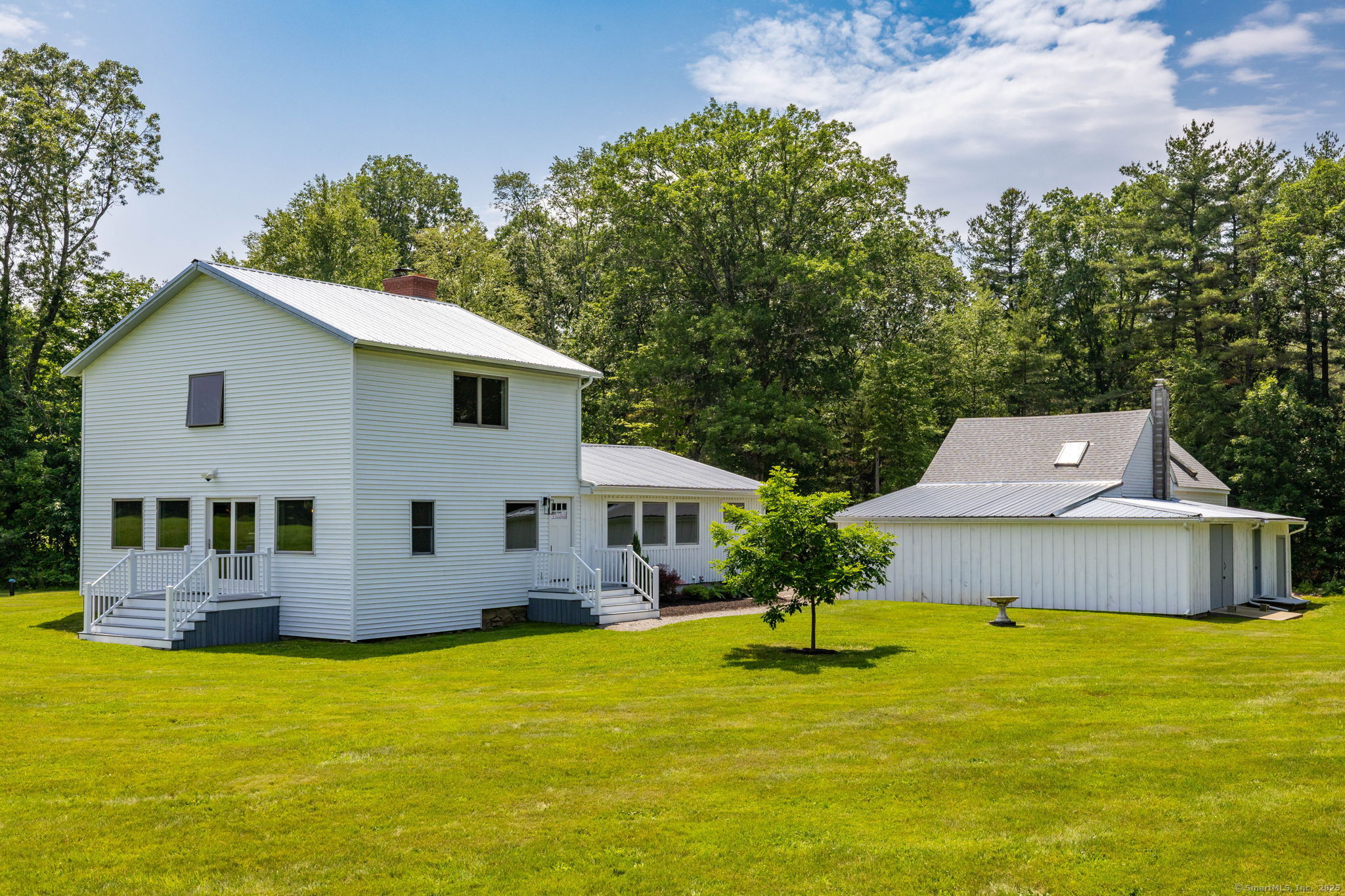 1669 Highway 169 Woodstock, CT 06281 - Photo 2 of 39 a front view of house with yard and swimming pool