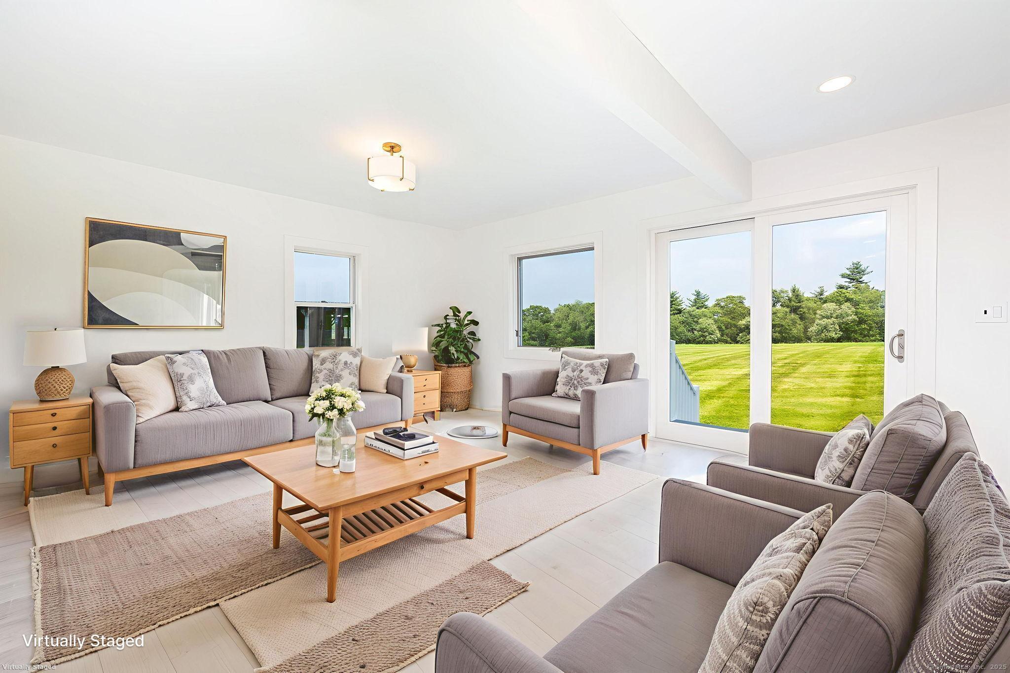 1669 Highway 169 Woodstock, CT 06281 - Photo 21 of 39 a living room with furniture and a large window