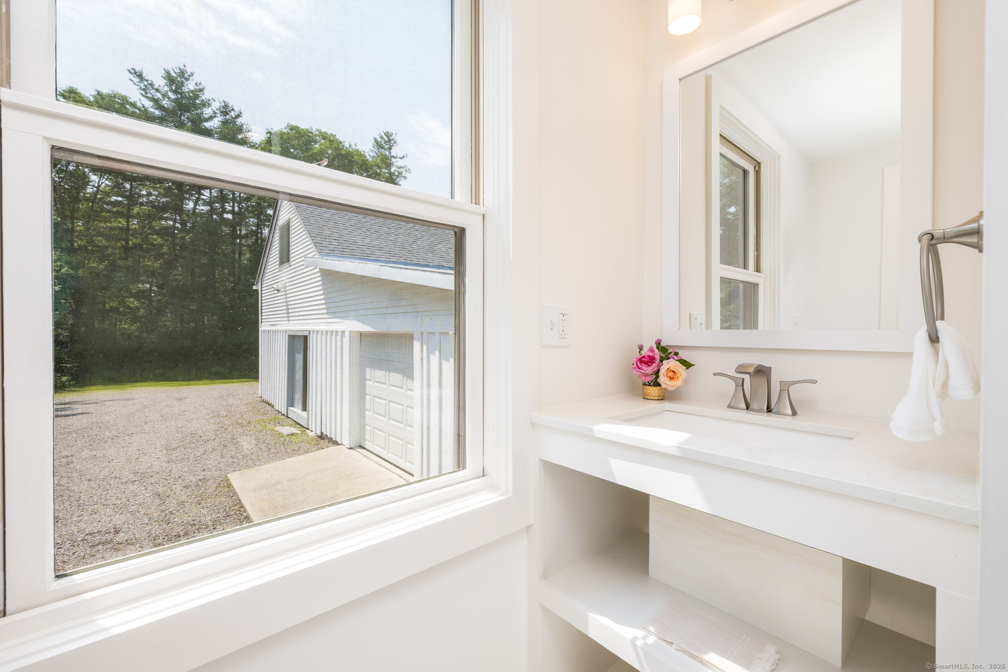 1669 Highway 169 Woodstock, CT 06281 - Photo 26 of 39 a bathroom with a sink and a mirror