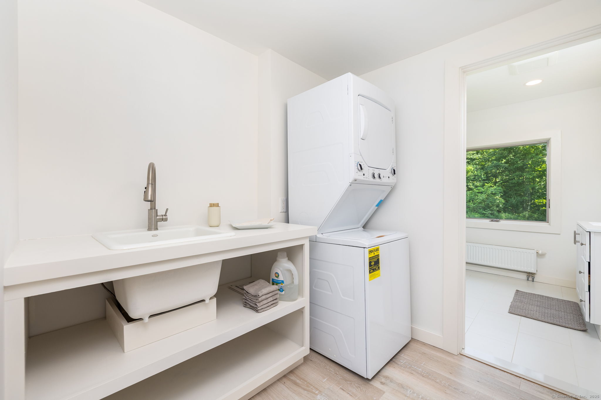 1669 Highway 169 Woodstock, CT 06281 - Photo 27 of 39 a bathroom with a sink and a mirror