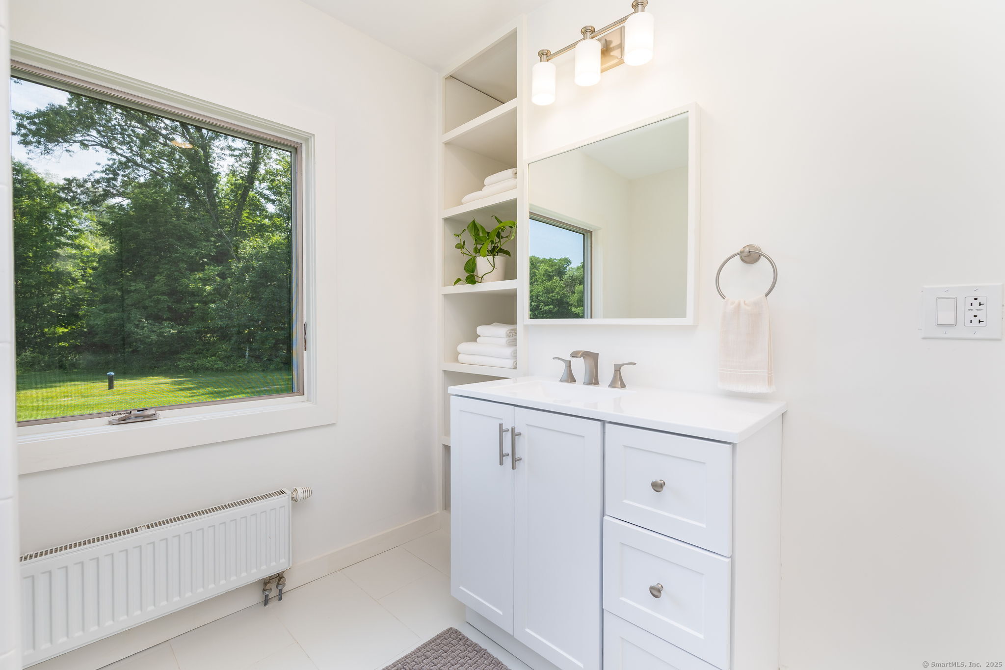 1669 Highway 169 Woodstock, CT 06281 - Photo 29 of 39 a bathroom with a sink and a mirror