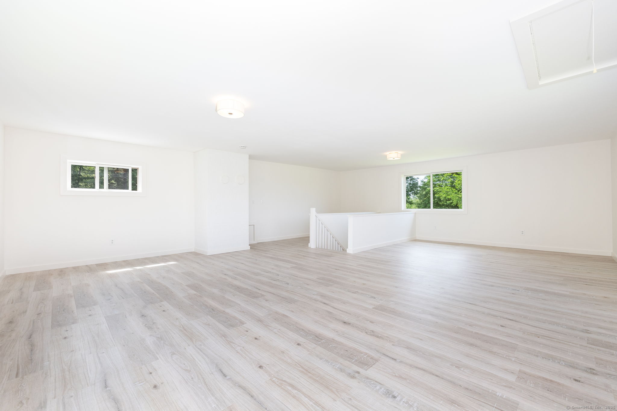 1669 Highway 169 Woodstock, CT 06281 - Photo 32 of 39 a view of an empty room with wooden floor and a window