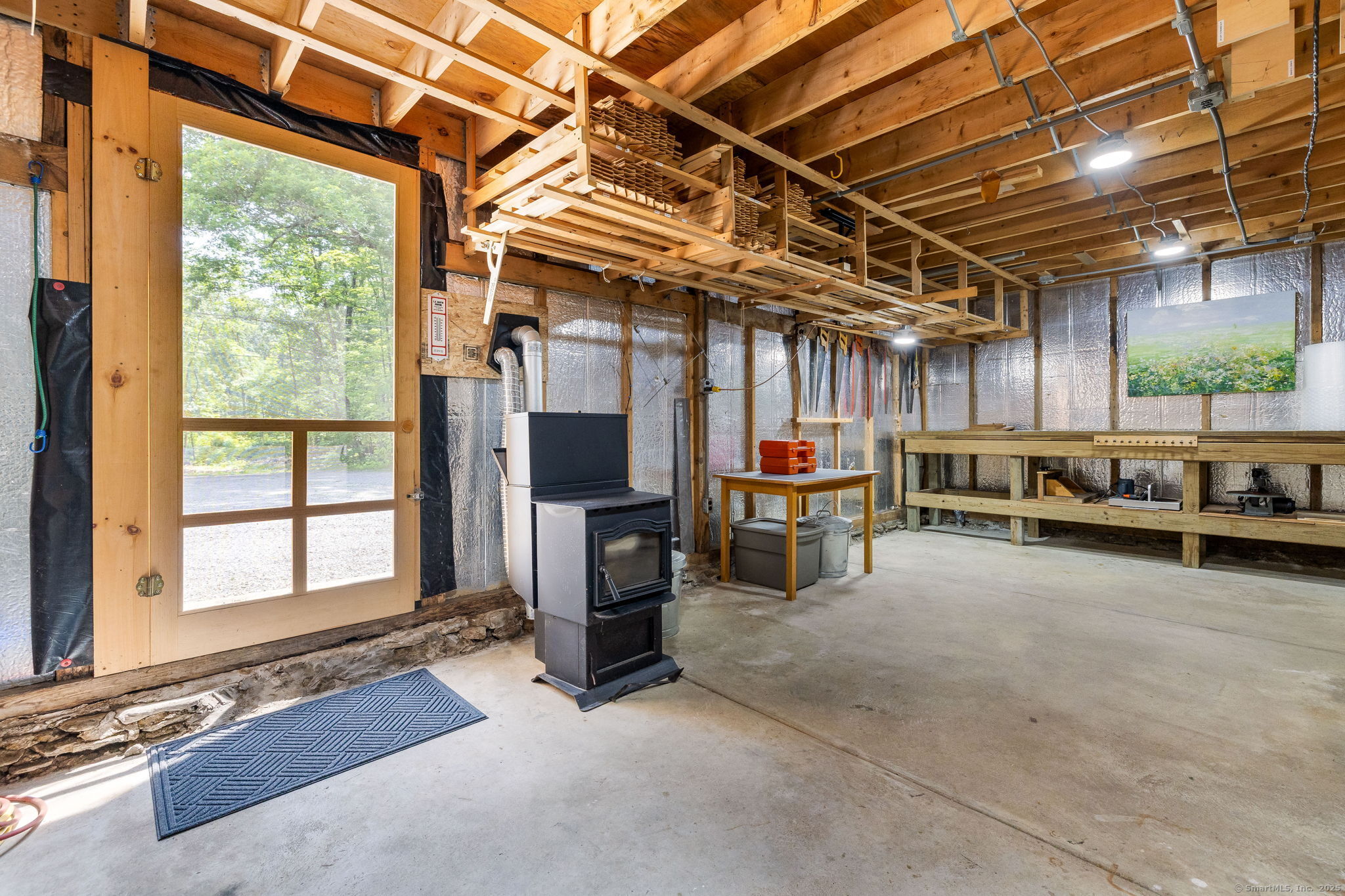 1669 Highway 169 Woodstock, CT 06281 - Photo 35 of 39 a view of a livingroom with furniture and a garage