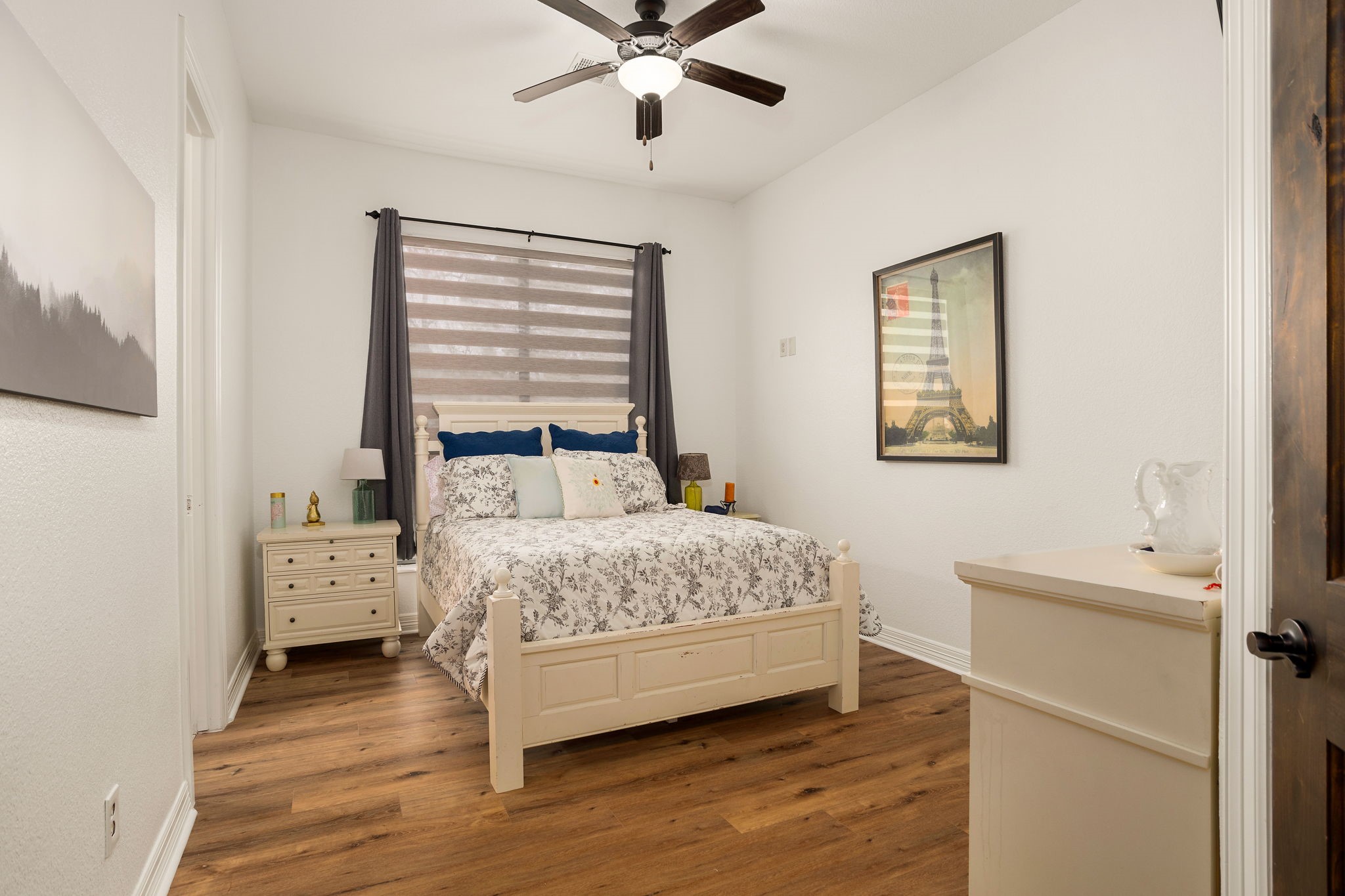 10210 Stidham Road Conroe, TX 77302 - Photo 26 of 39 a bedroom with a bed and a window