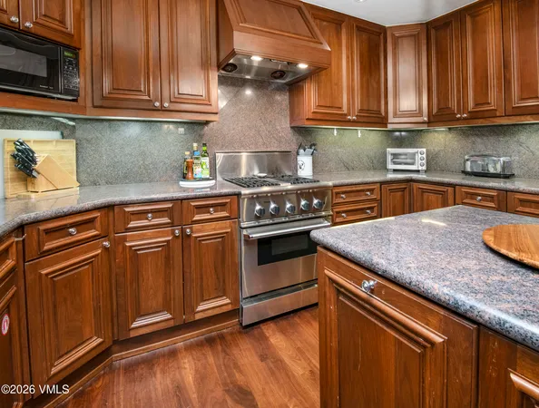 a bedroom with a bed and a fireplace