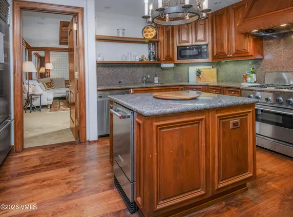 a spacious bathroom with a sink a mirror and a bathtub