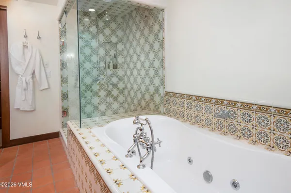 a kitchen with stainless steel appliances granite countertop a sink a stove and cabinets