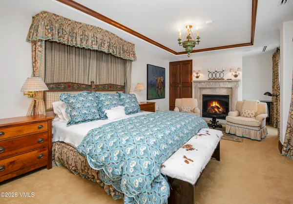 a living room with furniture a rug and a large window