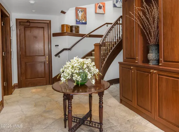 a kitchen with stainless steel appliances kitchen island granite countertop a refrigerator and a sink