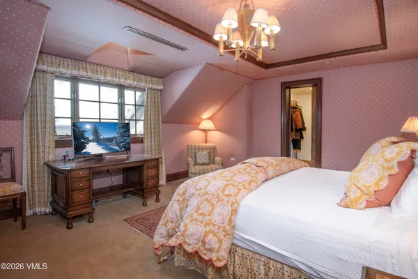a view of a living room and floor to ceiling window with wooden floor