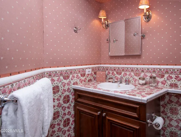 a bedroom with furniture and a large window