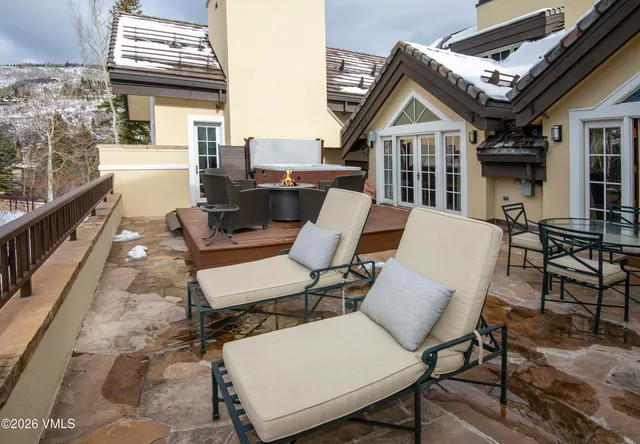 a bedroom with furniture and a large window