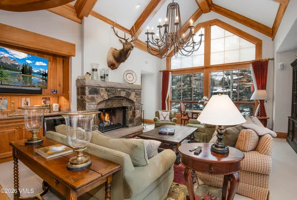 an aerial view of a house with swimming pool and furniture