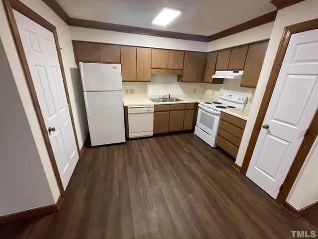 a kitchen with a refrigerator a sink and dishwasher