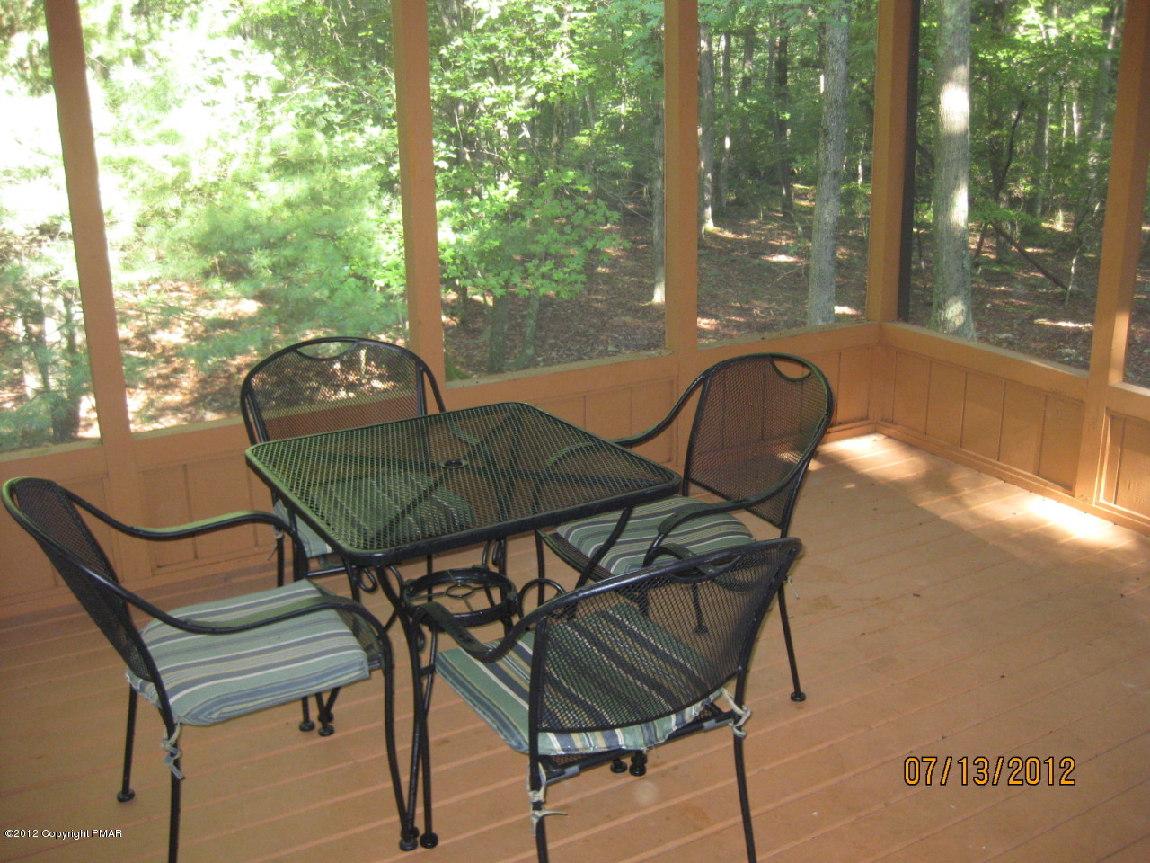 116 Grouse Road East Stroudsburg, PA 18301 - Photo 20 of 31 a backyard of a house with table and chairs