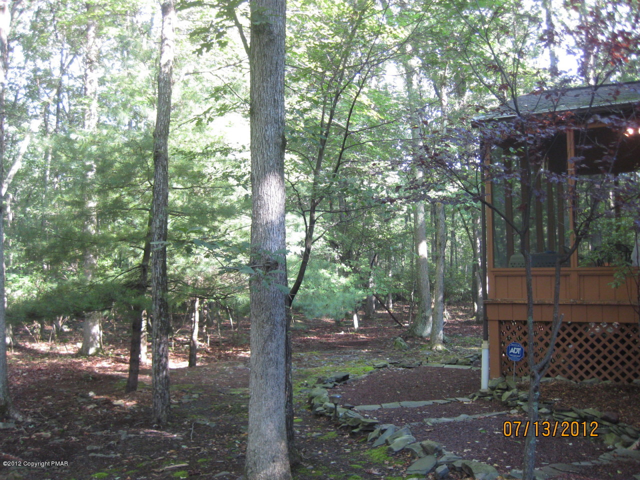 116 Grouse Road East Stroudsburg, PA 18301 - Photo 21 of 31 a view of a tree in the middle of a yard