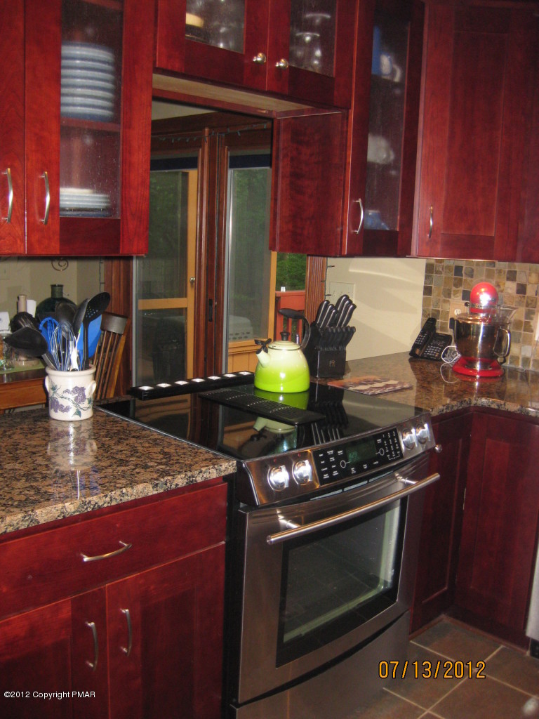 116 Grouse Road East Stroudsburg, PA 18301 - Photo 4 of 31 a kitchen with a stove and a cabinets