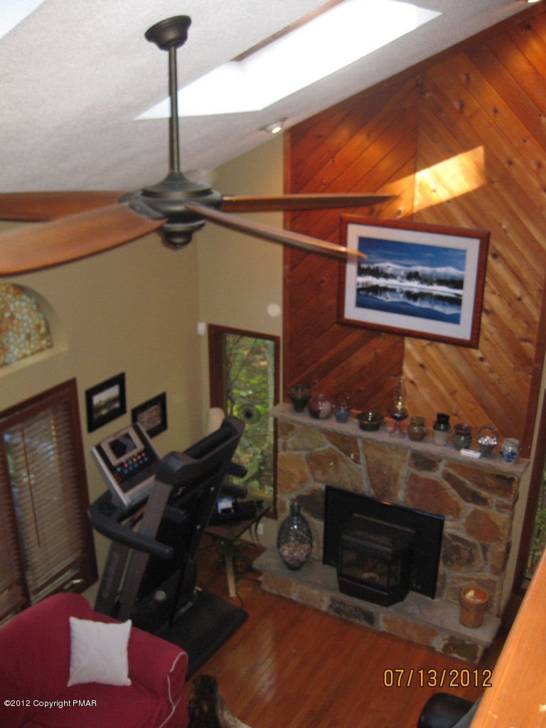 116 Grouse Road East Stroudsburg, PA 18301 - Photo 8 of 31 a living room with furniture and a fireplace