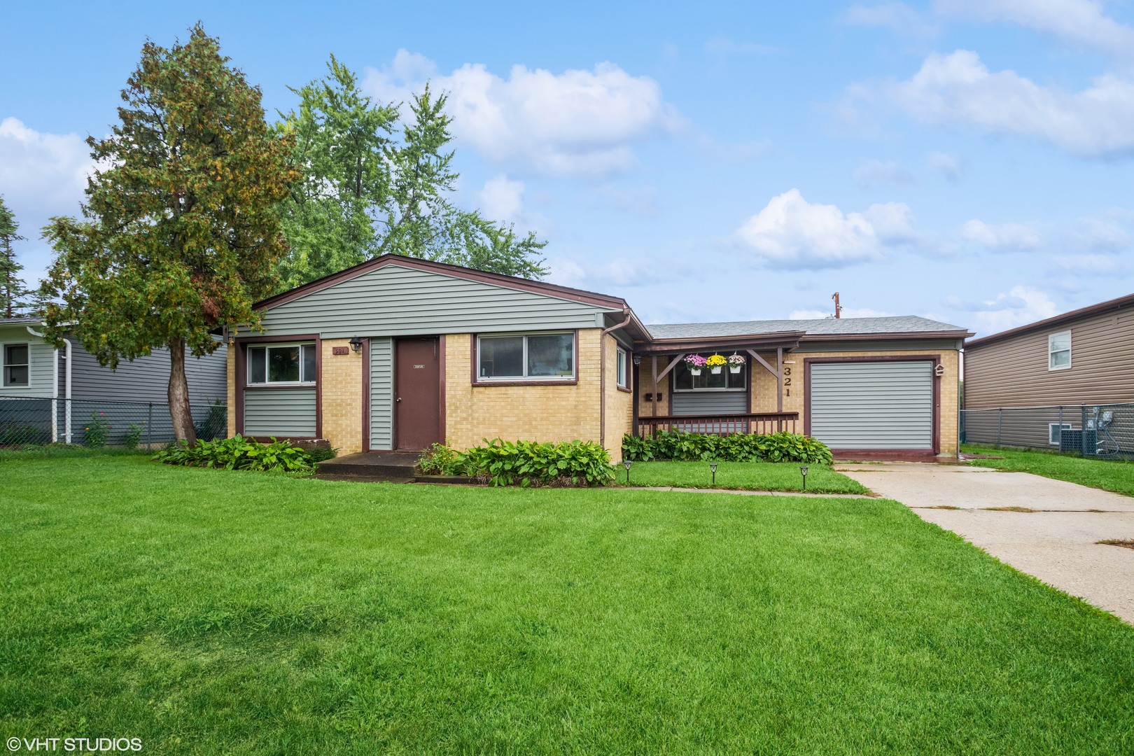 321 Walnut Drive Streamwood, IL 60107 - Photo 1 of 1 a front view of a house with a yard and trees