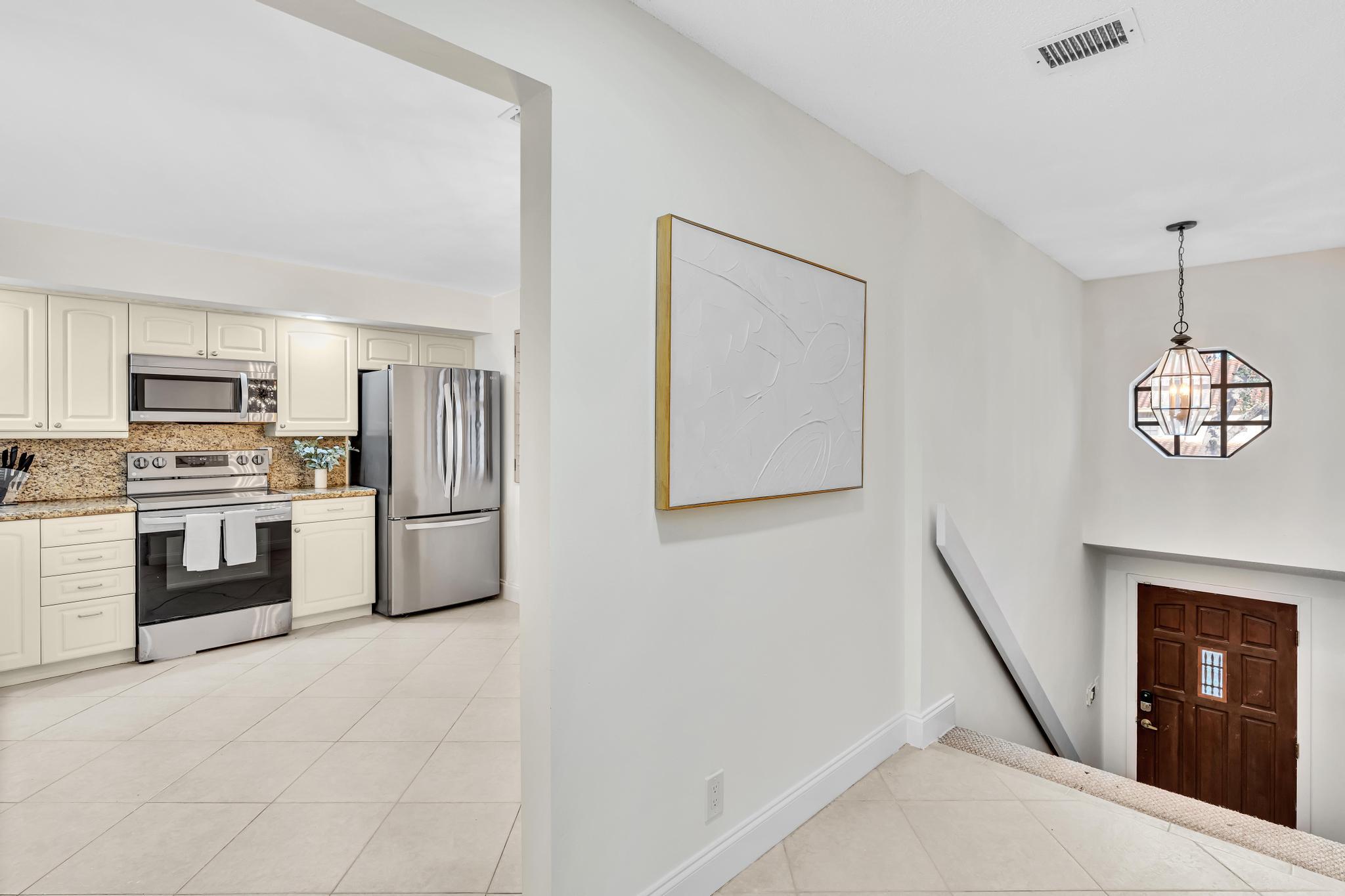 7718 La Mirada Drive Boca Raton, FL 33433 - Photo 5 of 56 Hallway to Kitchen