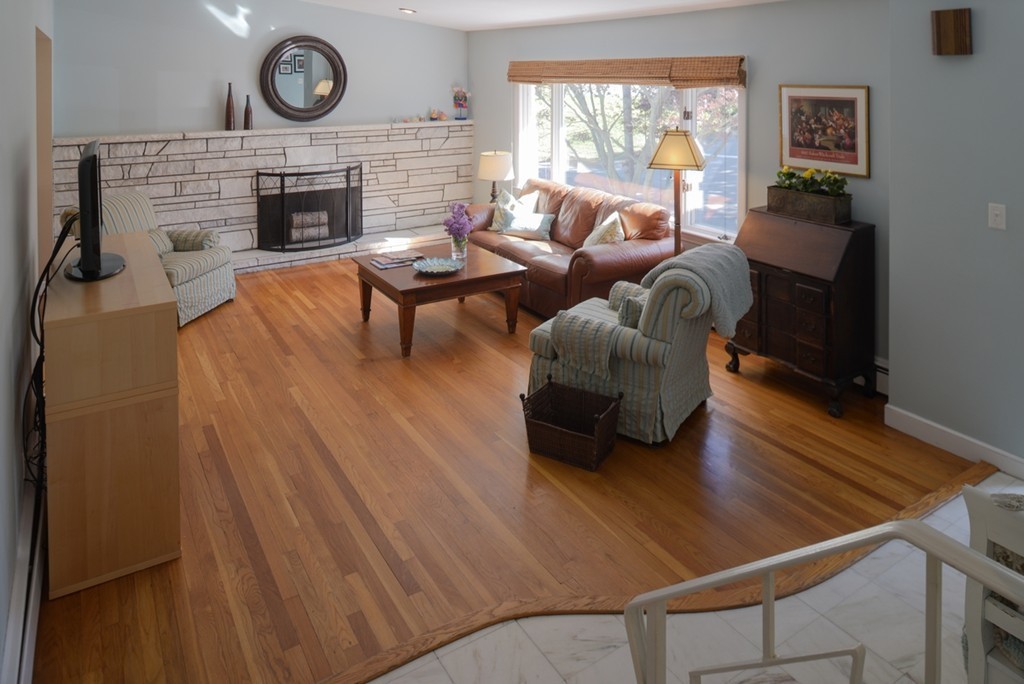 42 Cornell Road Marblehead, MA 01945 - Photo 5 of 30 a living room with furniture and a fireplace