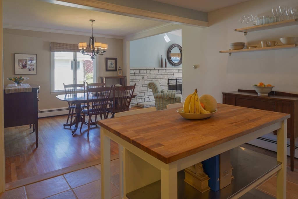 42 Cornell Road Marblehead, MA 01945 - Photo 8 of 30 a kitchen with a table chairs and wooden floor