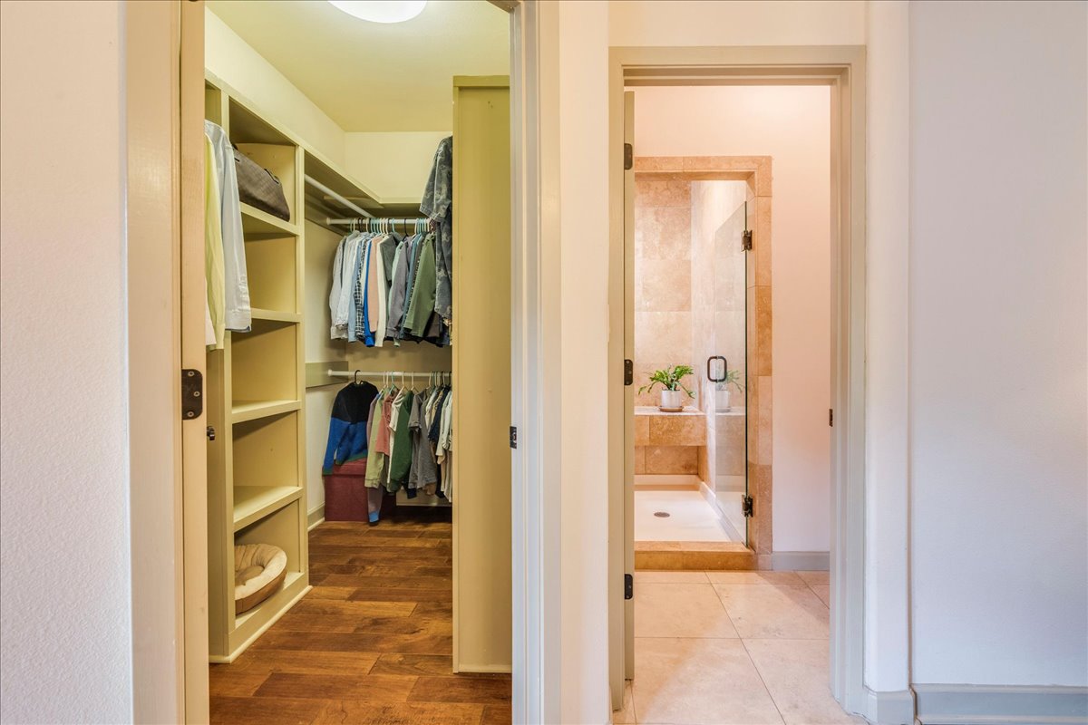 3012 South 4th Street, Unit B Austin, TX 78704 - Photo 18 of 40 Walk-in closet featuring wood-finish flooring and integrated shelving