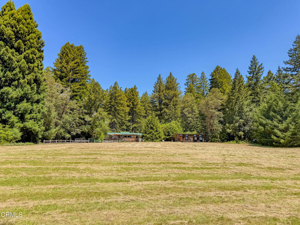 28680 Comptche Ukiah Road Comptche, CA 95427 - Photo 25 of 58 a view of a swimming pool with an outdoor space and seating area