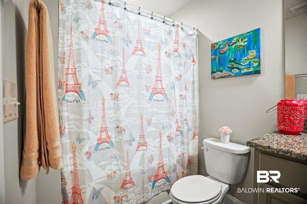 25806 Pollard Road, Unit 27 Daphne, AL 36526 - Photo 39 of 46 Full bath featuring vanity, curtained shower, and a textured wall