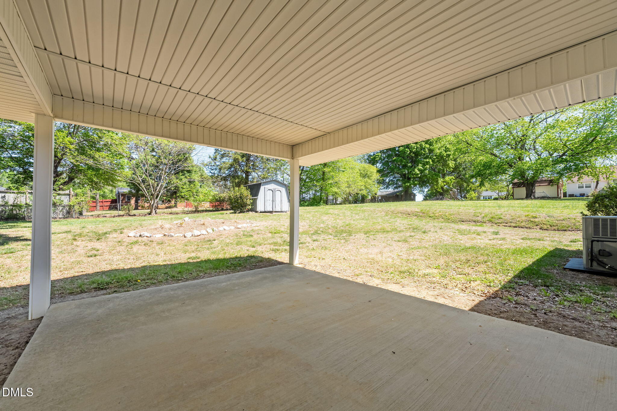 1723 Power Line Road Elon, NC 27244 - Photo 22 of 22 a view of an empty room with a yard