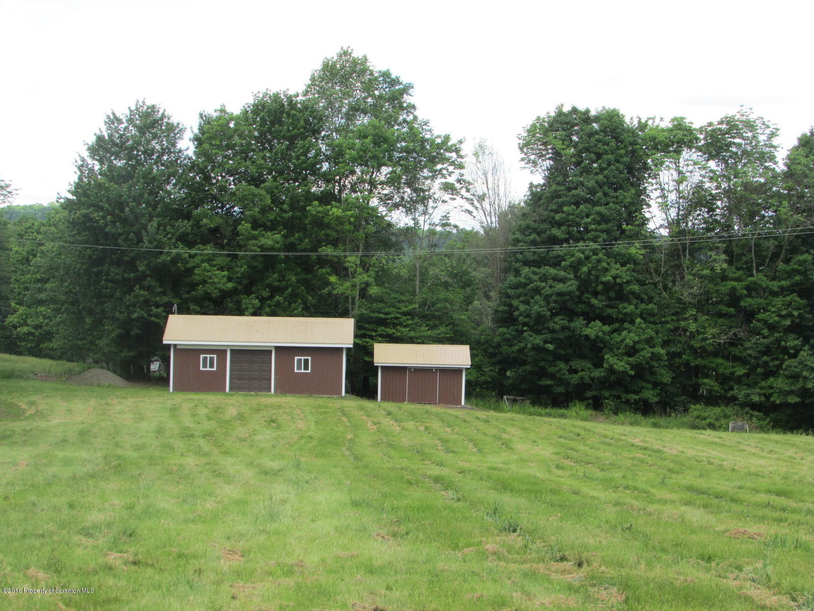 619 Litwin Road Meshoppen, PA 18630 - Photo 11 of 12 a house view with a sitting space and garden