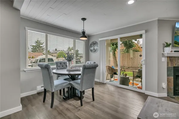 a dining room with furniture window wooden floor