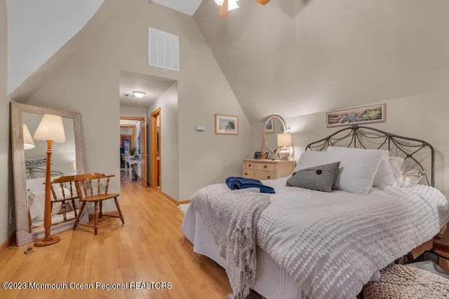 a bedroom with a bed and a table