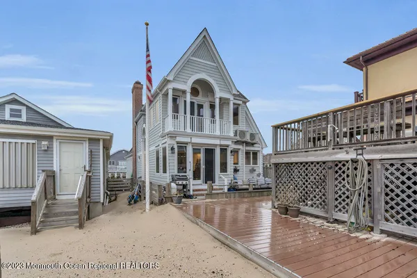 a view of a house with wooden deck