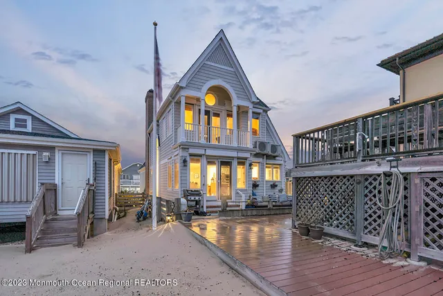 a view of livingroom with furniture staircase and front door