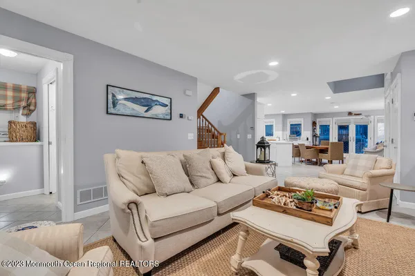 a living room with furniture and a rug