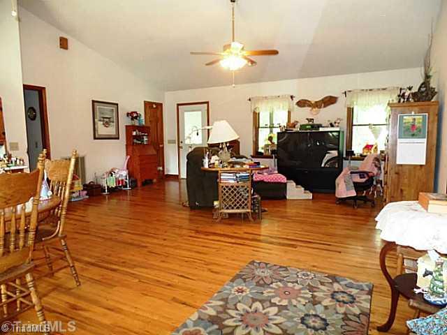 1101 Wray Road Stoneville, NC 27048 - Photo 2 of 15 Den/Family/Great Room. Large Greatroom / Dining area with vaulted ceiling and hardwood floors