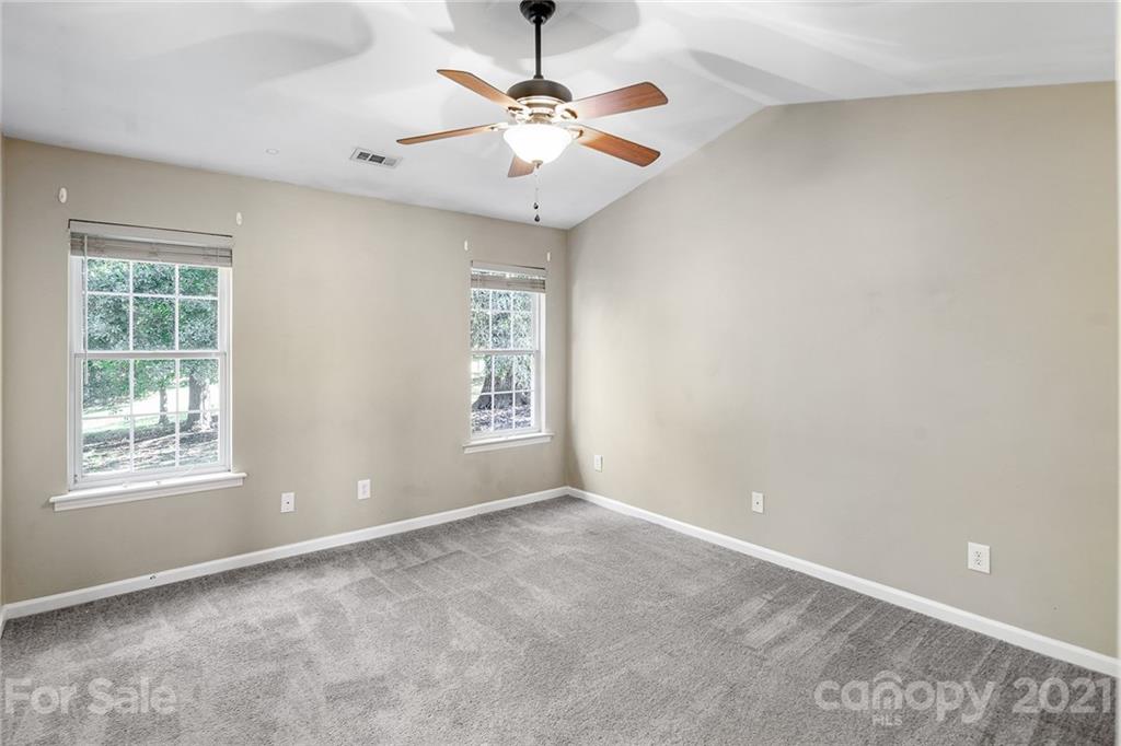 8577 Unity Church Road Denver, NC 28037 - Photo 16 of 33 a view of an empty room with a window