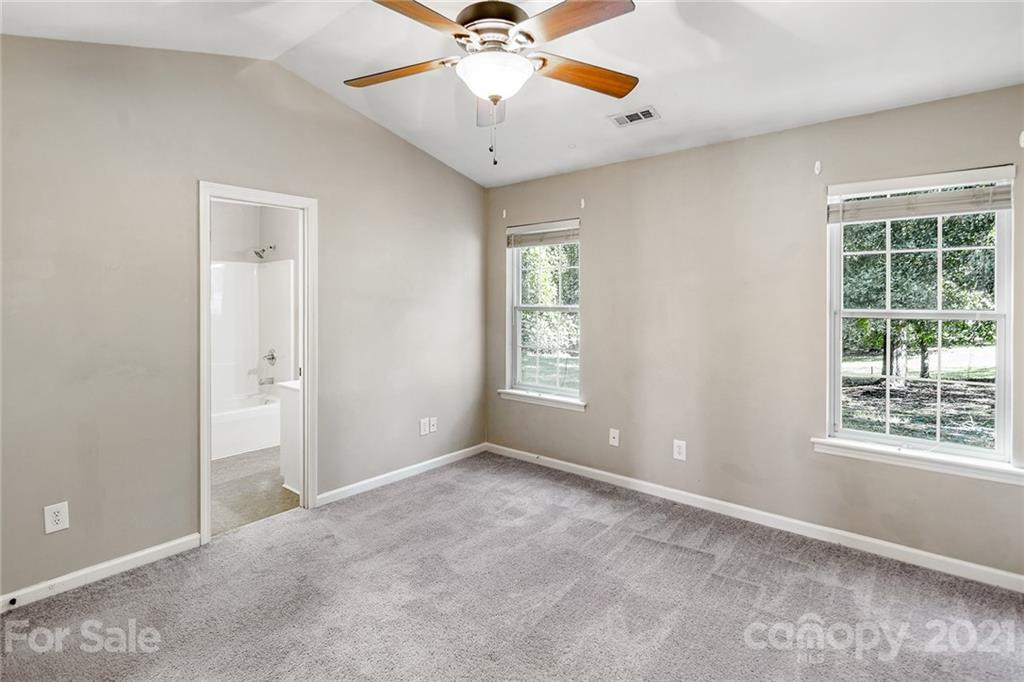 8577 Unity Church Road Denver, NC 28037 - Photo 19 of 33 a view of an empty room with a window