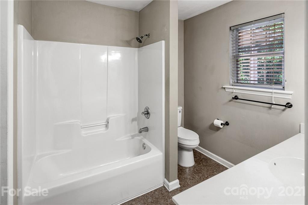 8577 Unity Church Road Denver, NC 28037 - Photo 20 of 33 a bathroom with a bathtub toilet and a shower